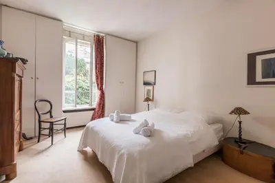 Un ou plusieurs lits dans un hébergement de l'établissement Veeve - Charming Townhouse near Parc Montsouris