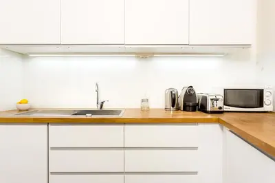 Cuisine ou kitchenette dans l'établissement Habitat Parisien - Montorgueil Suite