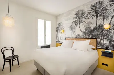Un ou plusieurs lits dans un hébergement de l'établissement Habitat Parisien - Montorgueil Suite