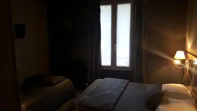 Un ou plusieurs lits dans un hébergement de l'établissement Café Hôtel de l'Avenir
