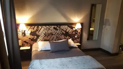 Un ou plusieurs lits dans un hébergement de l'établissement Café Hôtel de l'Avenir