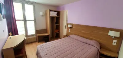 Un ou plusieurs lits dans un hébergement de l'établissement Hôtel des Pyrénées - Entre Bastille et Nation