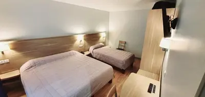 Un ou plusieurs lits dans un hébergement de l'établissement Hôtel des Pyrénées - Entre Bastille et Nation