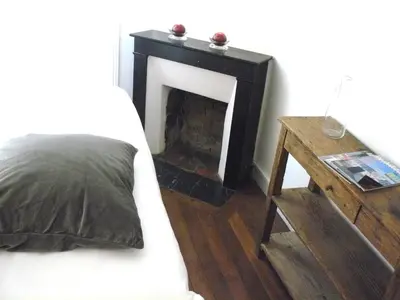 Un ou plusieurs lits dans un hébergement de l'établissement La Cour du 5ème - Chambre d'hôtes