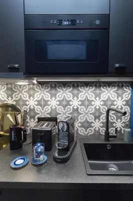 Cuisine ou kitchenette dans l'établissement Le Café des Invalides
