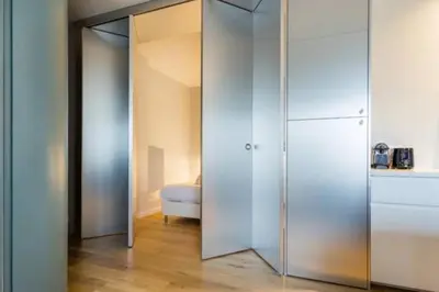 Un ou plusieurs lits dans un hébergement de l'établissement Appt calme balcon - Porte Maillot - Arc de Triomphe