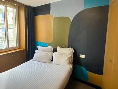 Un ou plusieurs lits dans un hébergement de l'établissement Appartement Censier Daubenton