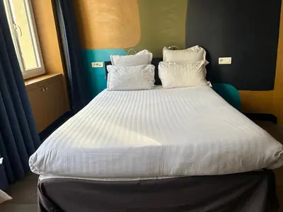 Un ou plusieurs lits dans un hébergement de l'établissement Appartement Censier Daubenton