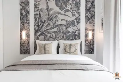 Un ou plusieurs lits dans un hébergement de l'établissement Montmartre Apartments Chagall