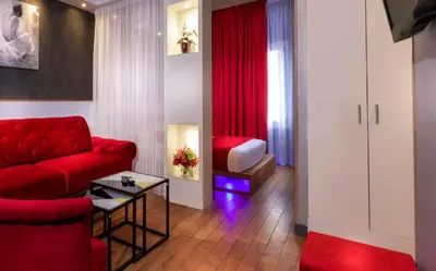 Coin salon dans l'établissement Hôtel Ambre