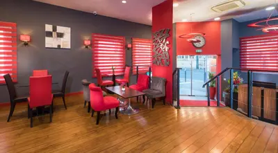 Coin salon dans l'établissement Hôtel Ambre