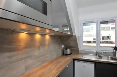 Cuisine ou kitchenette dans l'établissement Appart Paris Porte de Versailles