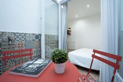 Un ou plusieurs lits dans un hébergement de l'établissement Hôtel Edgar Quinet