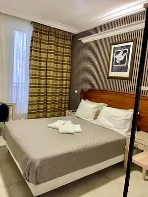 Un ou plusieurs lits dans un hébergement de l'établissement STYLE HOTEL