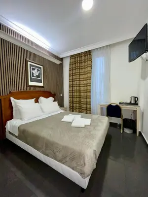 Un ou plusieurs lits dans un hébergement de l'établissement STYLE HOTEL