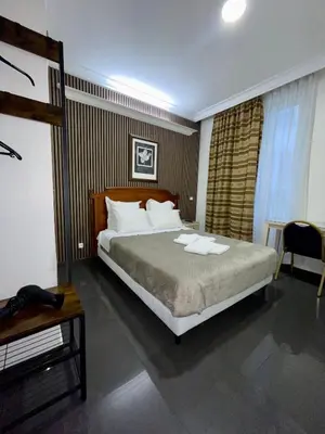 Un ou plusieurs lits dans un hébergement de l'établissement STYLE HOTEL