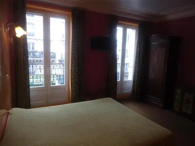 Un ou plusieurs lits dans un hébergement de l'établissement Hotel des Belges