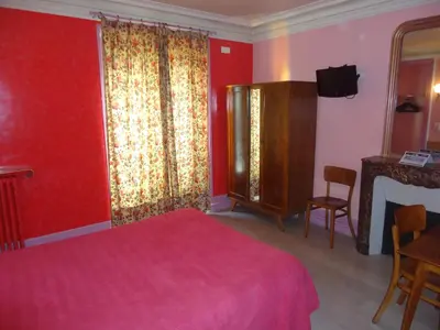 Un ou plusieurs lits dans un hébergement de l'établissement Hotel des Belges