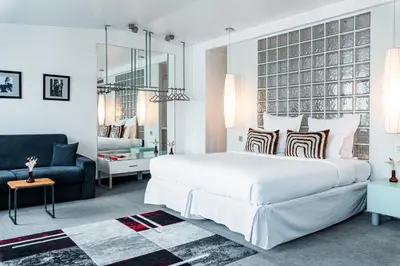 Un ou plusieurs lits dans un hébergement de l'établissement Kube Hôtel Paris