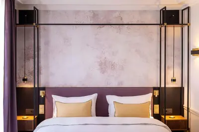 Un ou plusieurs lits dans un hébergement de l'établissement Victoria Palace Hotel