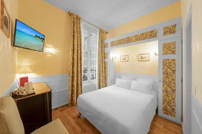 Un ou plusieurs lits dans un hébergement de l'établissement Hotel de la Bretonnerie