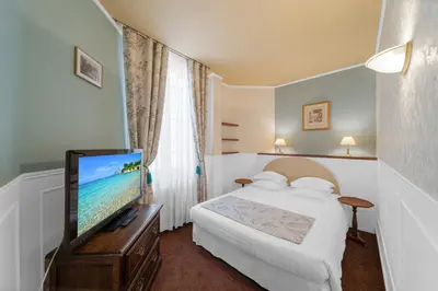 Un ou plusieurs lits dans un hébergement de l'établissement Hotel de la Bretonnerie