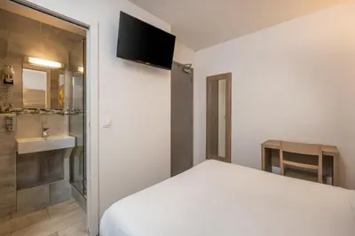 Télévision ou salle de divertissement dans l'établissement Hotel Luxor