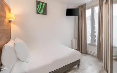 Un ou plusieurs lits dans un hébergement de l'établissement Hotel Luxor