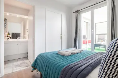 Un ou plusieurs lits dans un hébergement de l'établissement 2P cosy et moderne, Accès Paris et Stade de France