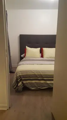 Un ou plusieurs lits dans un hébergement de l'établissement 2P cosy et moderne, Accès Paris et Stade de France