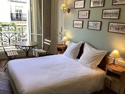 Un ou plusieurs lits dans un hébergement de l'établissement BED and BREAKFAST PARIS QUARTIER CHAMPS-ÉLYSÉES