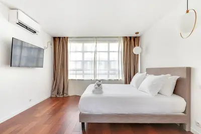 Un ou plusieurs lits dans un hébergement de l'établissement Pick A Flat's Apartment rue Pajol - La Chapelle