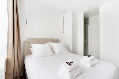 Un ou plusieurs lits dans un hébergement de l'établissement Pick A Flat's Apartment rue Pajol - La Chapelle