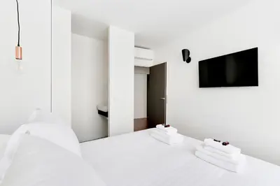 Un ou plusieurs lits dans un hébergement de l'établissement Pick A Flat's Apartment rue Pajol - La Chapelle