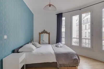 Un ou plusieurs lits dans un hébergement de l'établissement Lovely Parisian Flat - Louvre rue St Honoré