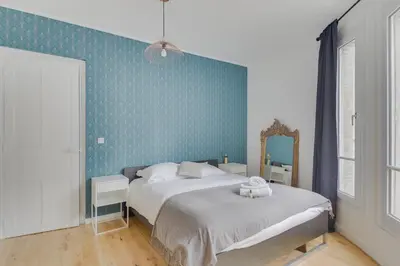 Un ou plusieurs lits dans un hébergement de l'établissement Lovely Parisian Flat - Louvre rue St Honoré