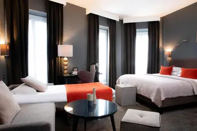 Un ou plusieurs lits dans un hébergement de l'établissement Hôtel Plaza Étoile