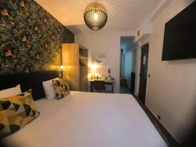 Un ou plusieurs lits dans un hébergement de l'établissement Hotel Le Twelve