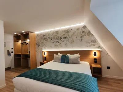 Un ou plusieurs lits dans un hébergement de l'établissement 55 Hôtel Montparnasse