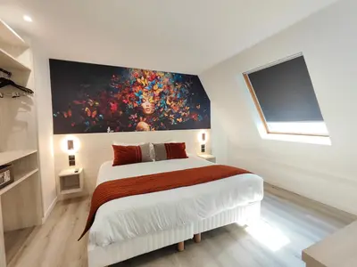 Un ou plusieurs lits dans un hébergement de l'établissement 55 Hôtel Montparnasse