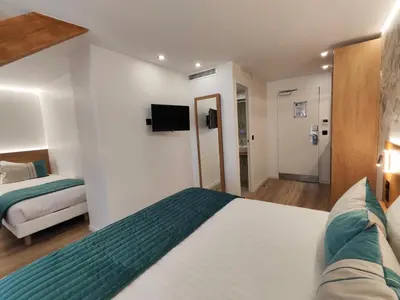Un ou plusieurs lits dans un hébergement de l'établissement 55 Hôtel Montparnasse