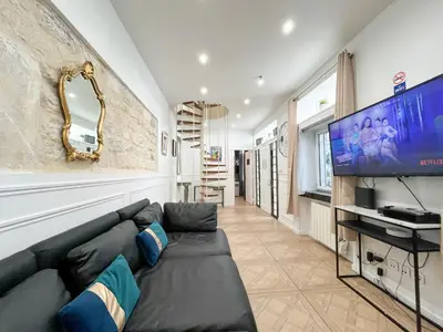 Télévision ou salle de divertissement dans l'établissement Urban Flat 74 - Disneyland in Paris