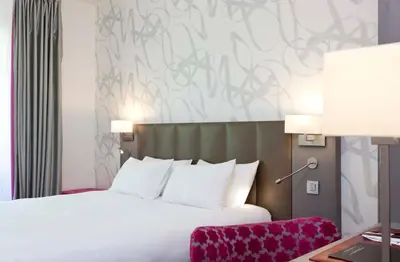Un ou plusieurs lits dans un hébergement de l'établissement Hotel Massena