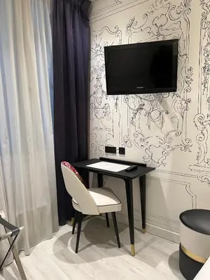Télévision ou salle de divertissement dans l'établissement Hotel Massena