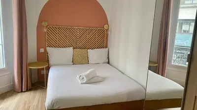 Un ou plusieurs lits dans un hébergement de l'établissement Appartement lumineux proche Saint-Lazare - 8P