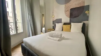Un ou plusieurs lits dans un hébergement de l'établissement Appartement lumineux proche Saint-Lazare - 8P