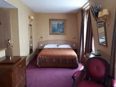 Un ou plusieurs lits dans un hébergement de l'établissement Hôtel Transcontinental
