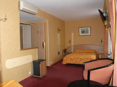 Un ou plusieurs lits dans un hébergement de l'établissement Hôtel Transcontinental
