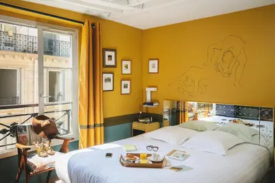 Un ou plusieurs lits dans un hébergement de l'établissement Hôtel Crayon