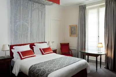 Un ou plusieurs lits dans un hébergement de l'établissement Hôtel Mansart - Esprit de France